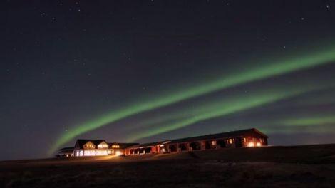The Northern Lights with luxury Rangá accommodations in view