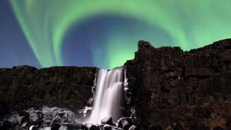 Northern Lights and waterfall in Iceland